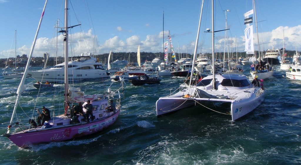 Jessica Watson with some of the estimated 1500 boats that came out to greet her on Sydney Harbour © NSW Maritime http://www.maritime.nsw.gov.au